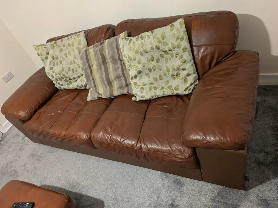 Two times two seaters with a chair and a foot storage stool.