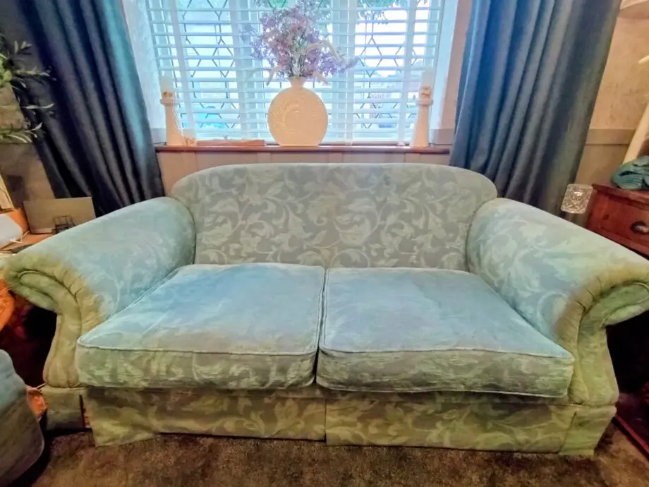 Blue three seater fabric sofa