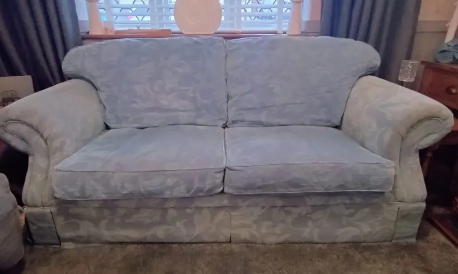 Blue three seater fabric sofa