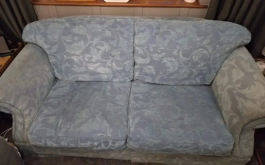 Blue three seater fabric sofa