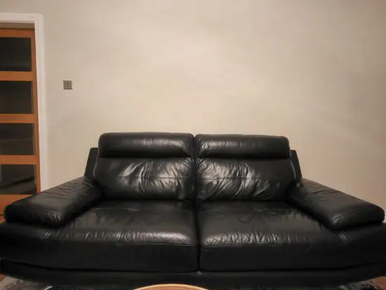 DFS black leather 3 seater sofa and matching chair