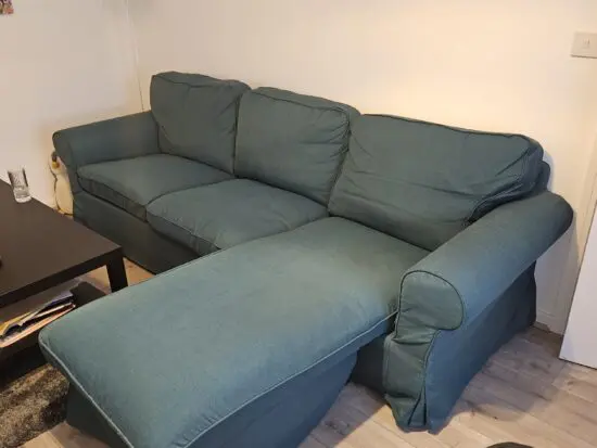 Dark Green Ikea 3 seater sofa with chaise longue