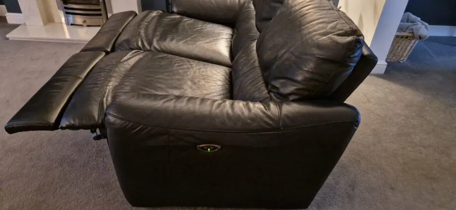 DFS black leather recliner sofas and footstool