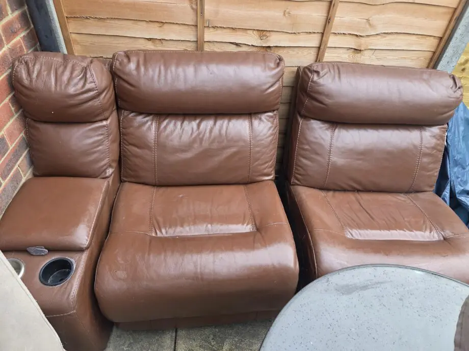 DFS Brown leather corner and console and footstall