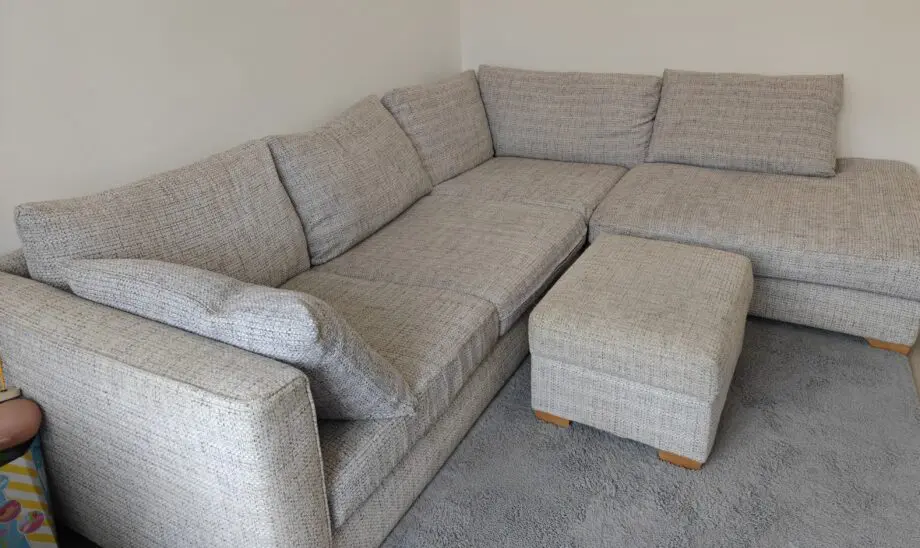 Grey corner sofa and foot stool