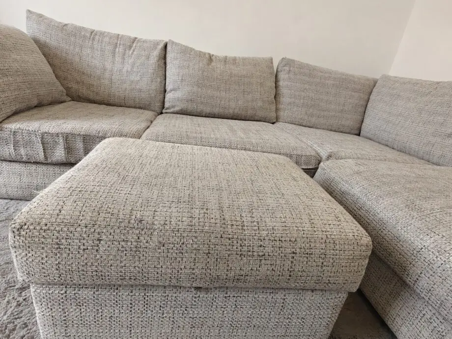 Grey corner sofa and foot stool
