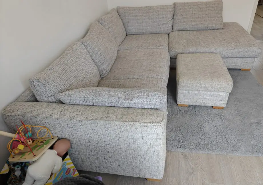 Grey corner sofa and foot stool