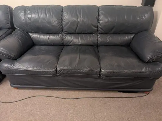 Navy blue leather sofa set. 2 single sofas are manual reclining. Another 3 seater and 2 seater