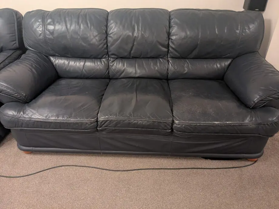 Navy blue leather sofa set. 2 single sofas are manual reclining. Another 3 seater and 2 seater
