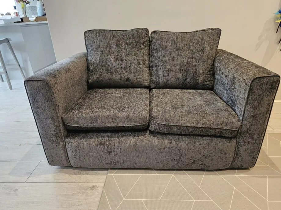 Grey 2 seater sofa with removable cushion covers