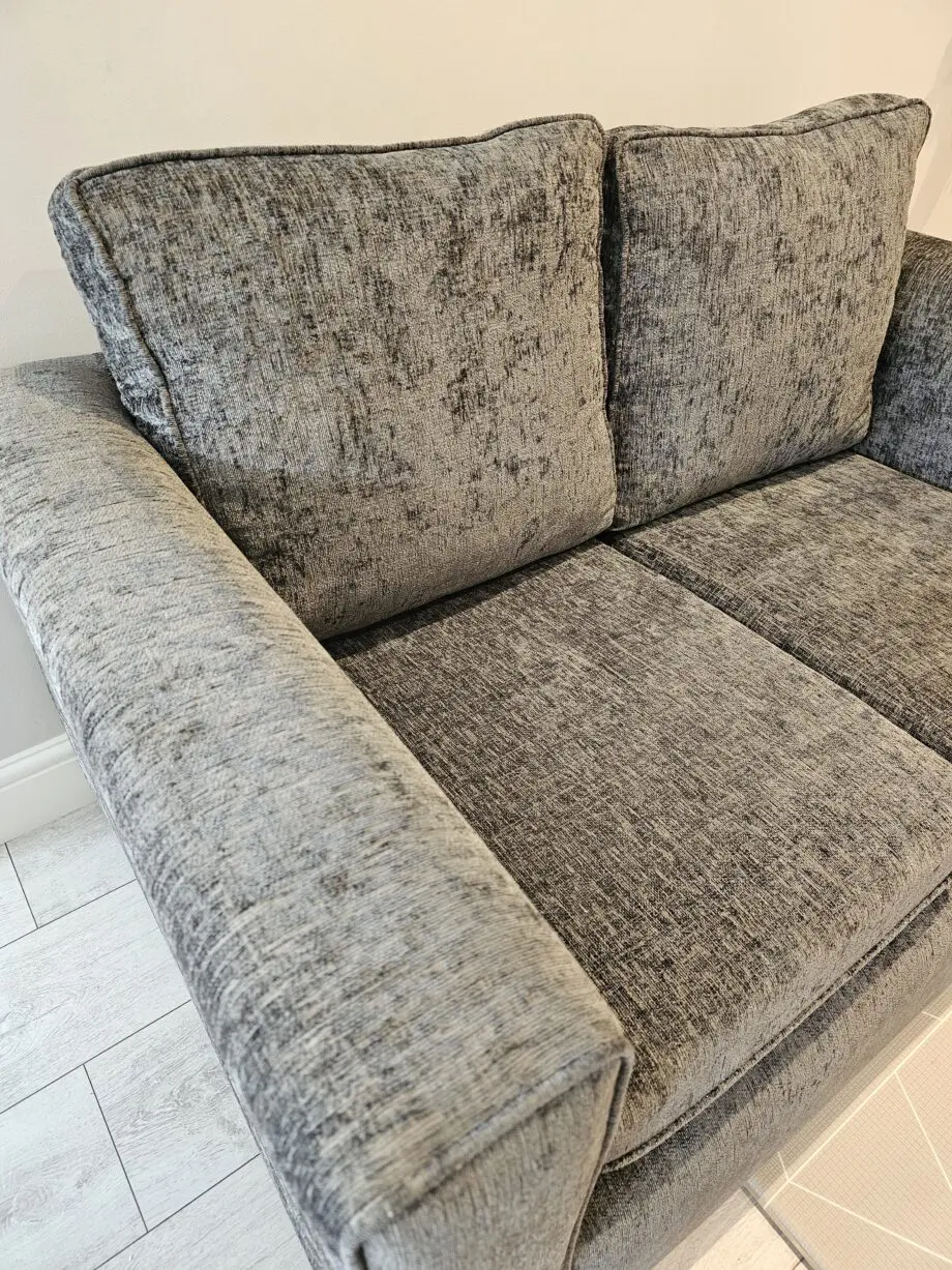 Grey 2 seater sofa with removable cushion covers