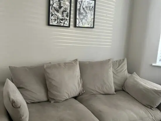 DFS plush velvet pillow back 3 seater and cuddle couch in stone