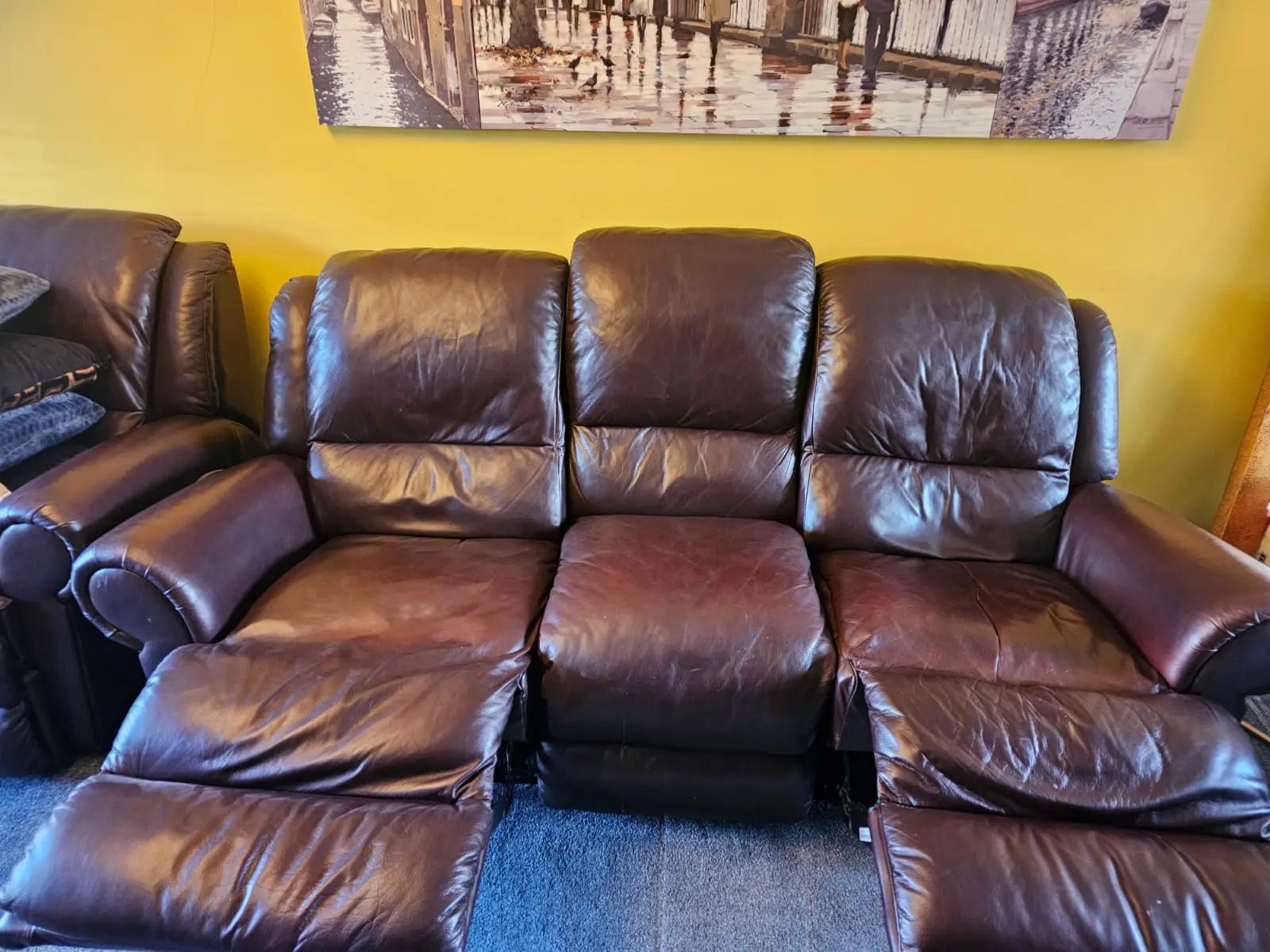 Brown three-seater sofa