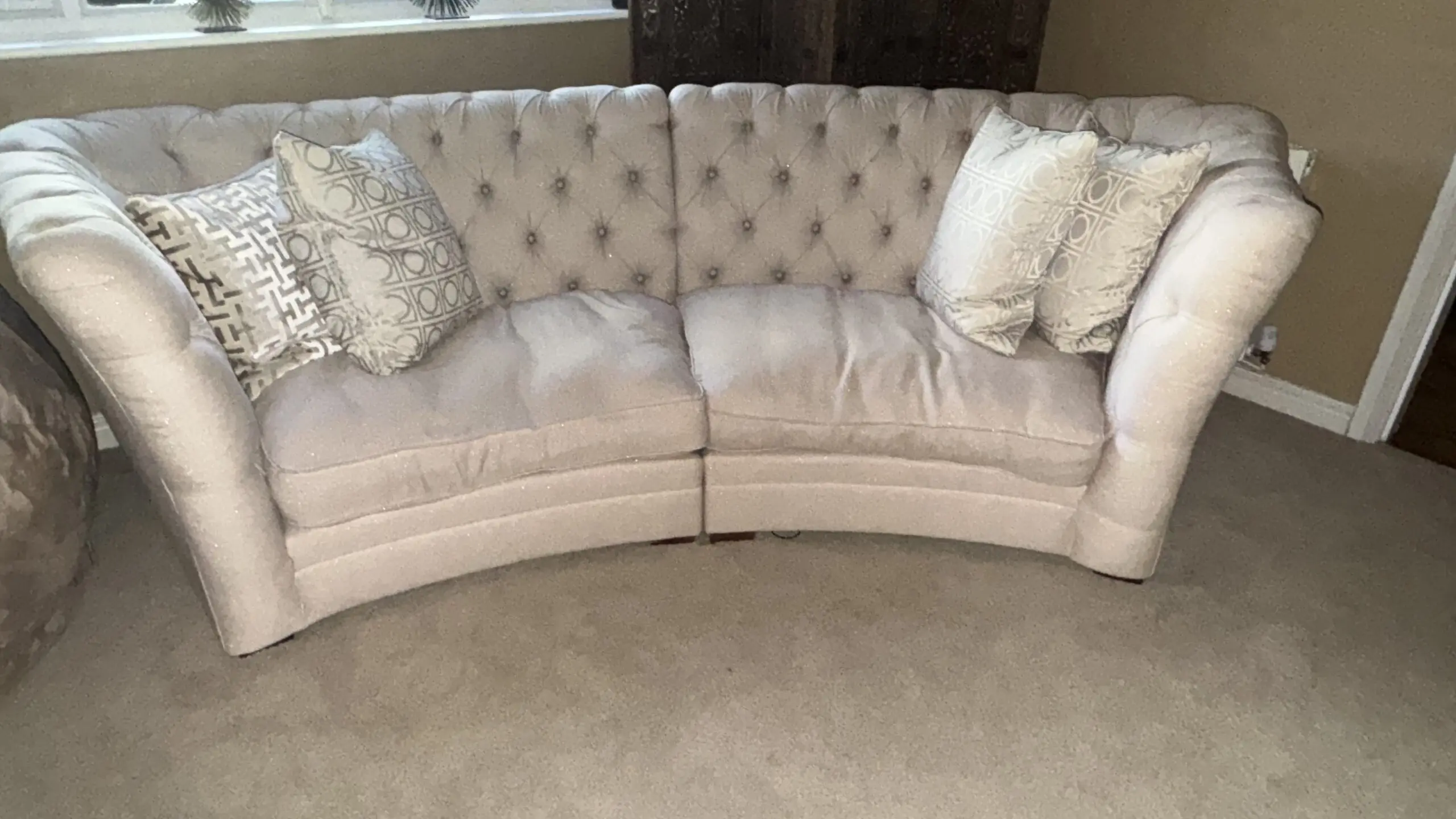 Stunning, large, curved three-section sofa in cream, with metallic silver threads that sparkle in the sun. The full set cost us £5,000. 4 seater: 383cm width, front edge width is 258cm, overall depth is 161cm (depth of each seat is 107cm). 3 seater: 290cm width, front edge width is 198cm, overall depth is 161cm (depth of each seat is 107cm). Cristiana