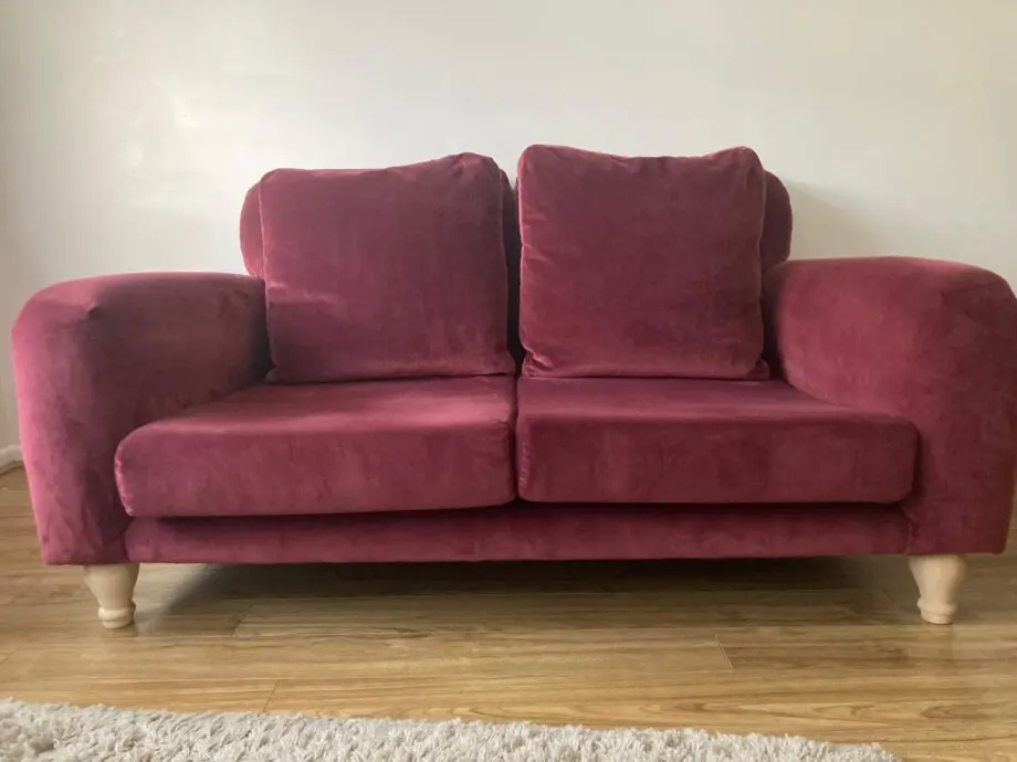 Loaf “Bear Hug” velvet sofa in colour Drenched Damsons (maroon / dark pink)
