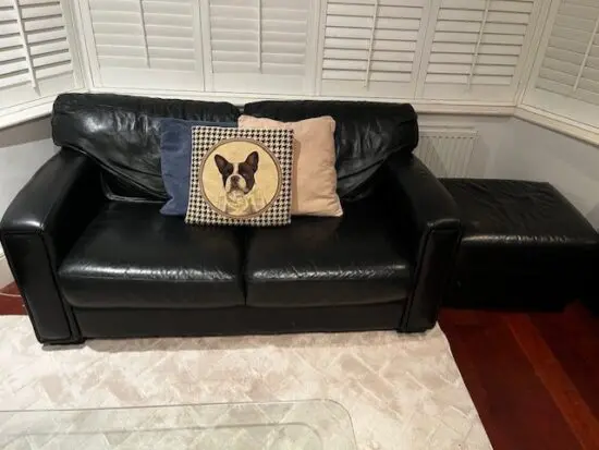 A set of 2 Black Leather sofa's