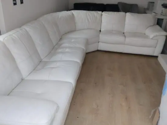 Leekes 7 seater leather corner sofa in stone / ivory