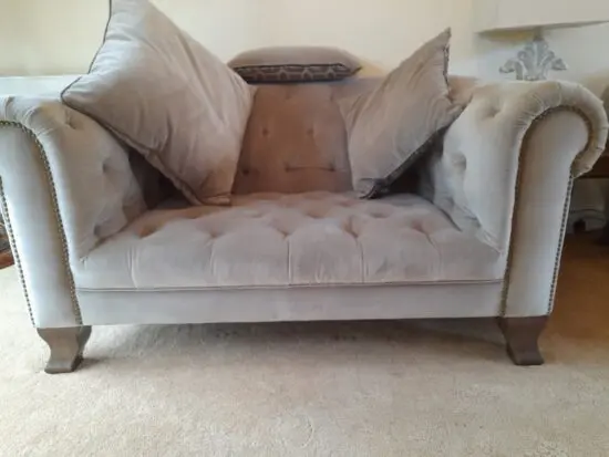 Ponsfords, Alexander and James. Mink velvet fabric snuggler chair.