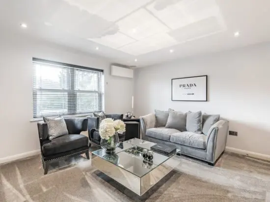 Beautiful designer 2 seater sofa in Light Grey suede effect fabrix. Hardly used!