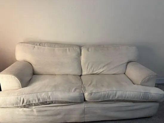 Beige 2 seater sofa