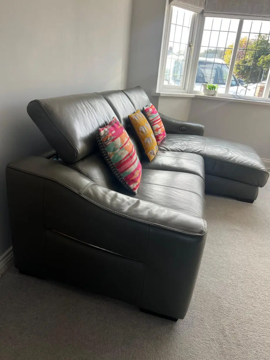 Furniture village, leather sofa with power recliner