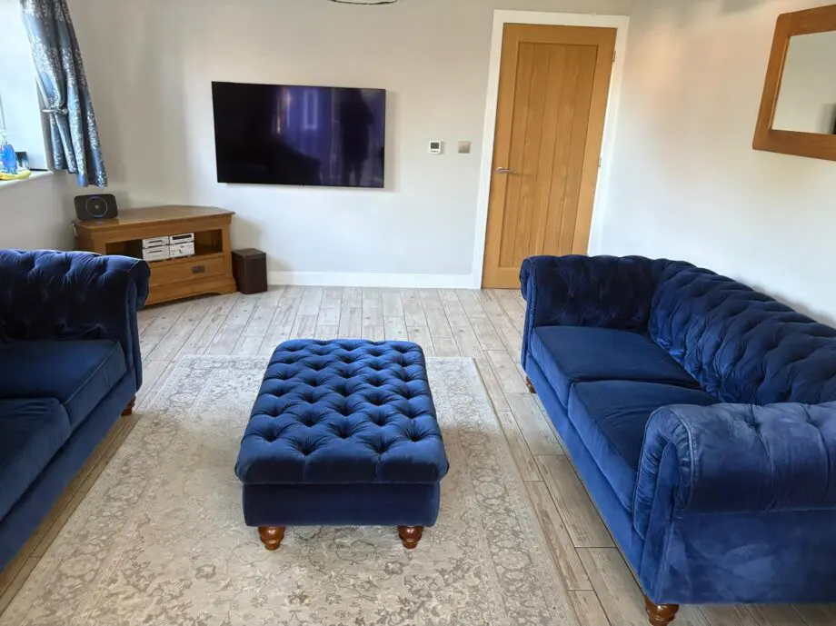 2 x Navy Velvet Chesterfield Sofas & Footstall excellent condition