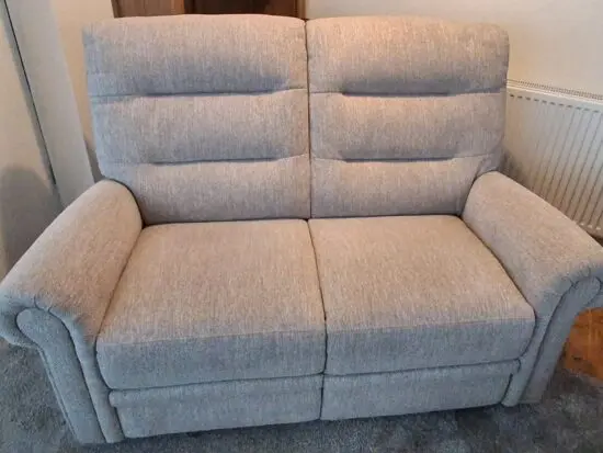 2 seater beige coloured sofa from Oak Furniture Land almost brand new