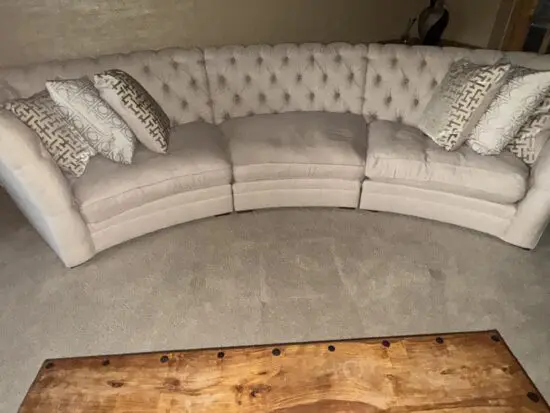 Stunning, large, curved three-section sofa in cream, with metallic silver threads that sparkle in the sun. The full set cost us £5,000. 4 seater: 383cm width, front edge width is 258cm, overall depth is 161cm (depth of each seat is 107cm). 3 seater: 290cm width, front edge width is 198cm, overall depth is 161cm (depth of each seat is 107cm). Cristiana