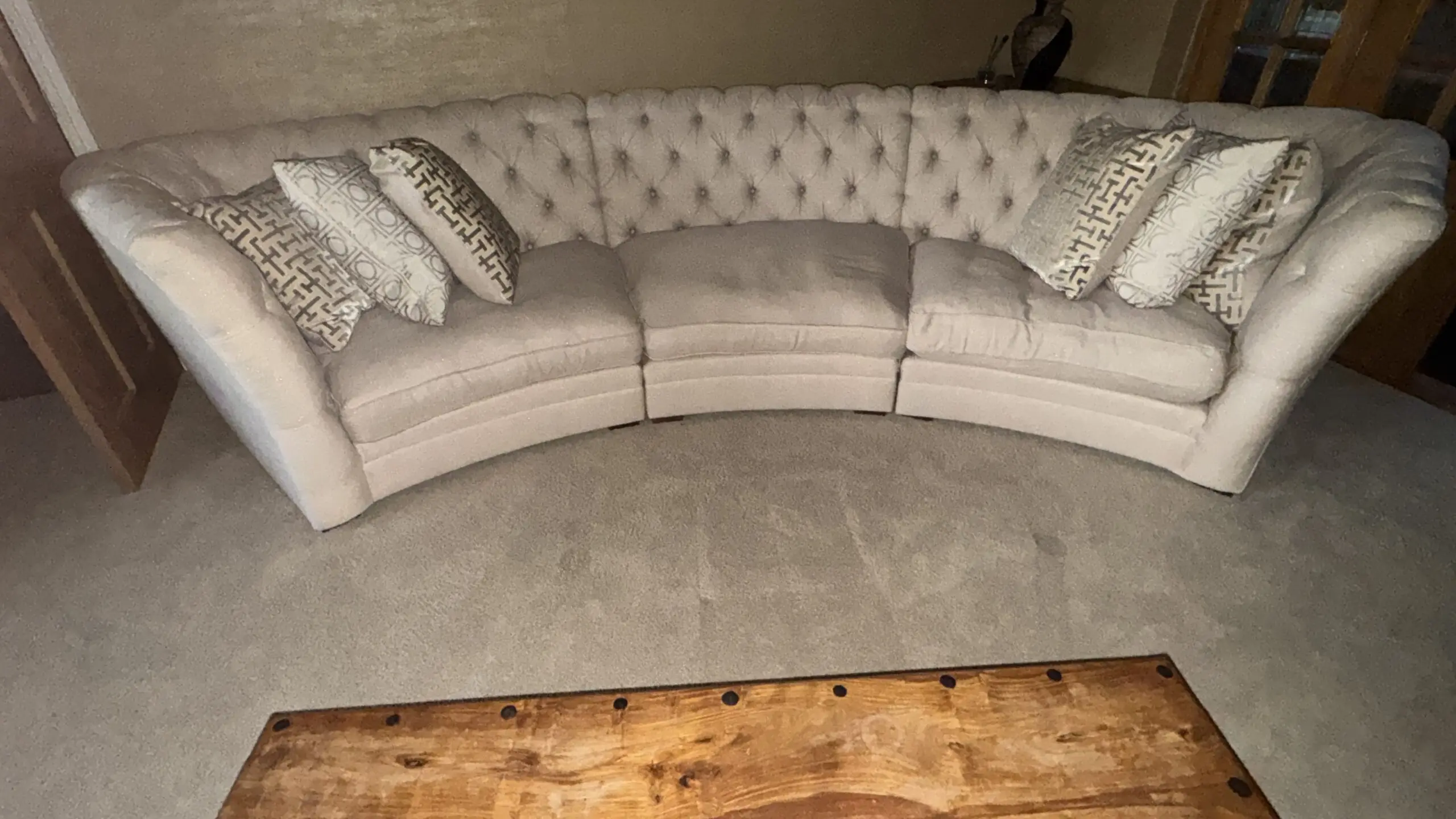 Stunning, large, curved three-section sofa in cream, with metallic silver threads that sparkle in the sun. The full set cost us £5,000. 4 seater: 383cm width, front edge width is 258cm, overall depth is 161cm (depth of each seat is 107cm). 3 seater: 290cm width, front edge width is 198cm, overall depth is 161cm (depth of each seat is 107cm). Cristiana