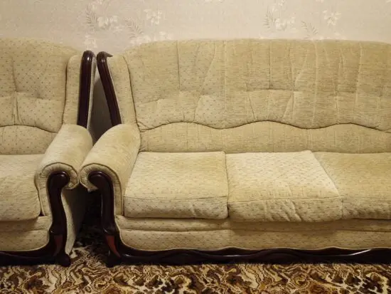 4 seater beige sofa with brown wood surround
