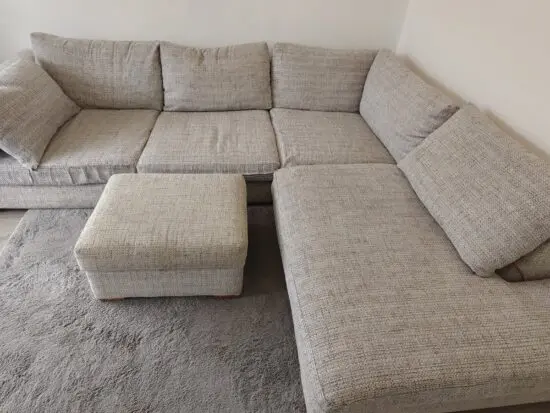 Grey corner sofa and foot stool