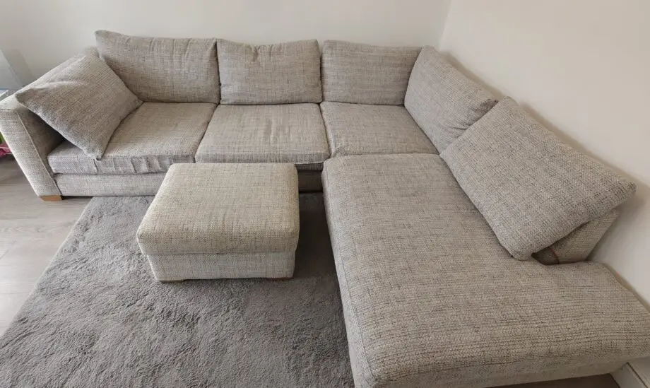 Grey corner sofa and foot stool