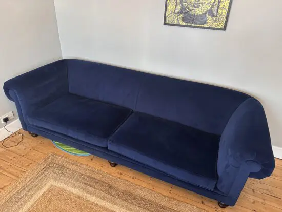 Distinctive Chesterfield made in UK blue velvet 4 seater sofa