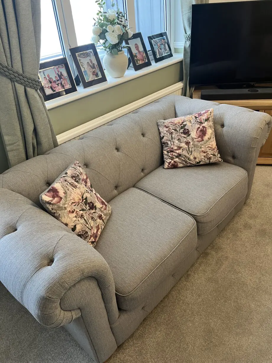Two lovely grey fabric sofas