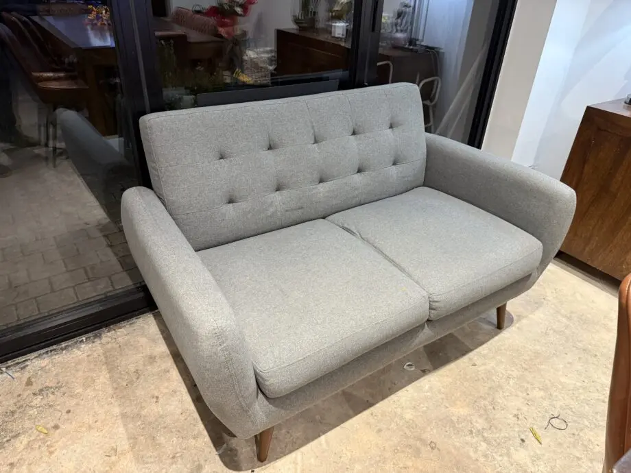 Grey two seater sofa