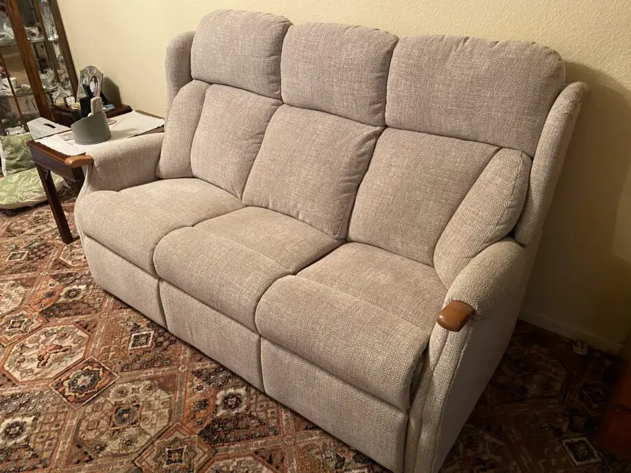 Virtually new Three seater sofa.