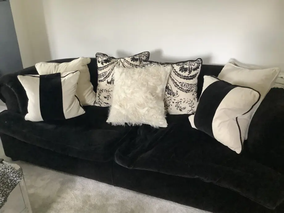 Heals 4 Seater and 3 Seater sofas. Black velvet. Chesterfield Style.