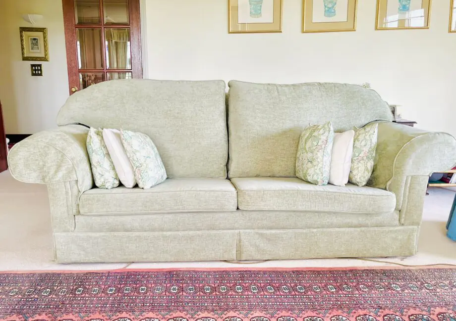 Newly upholstered pale sage 2 seater sofa