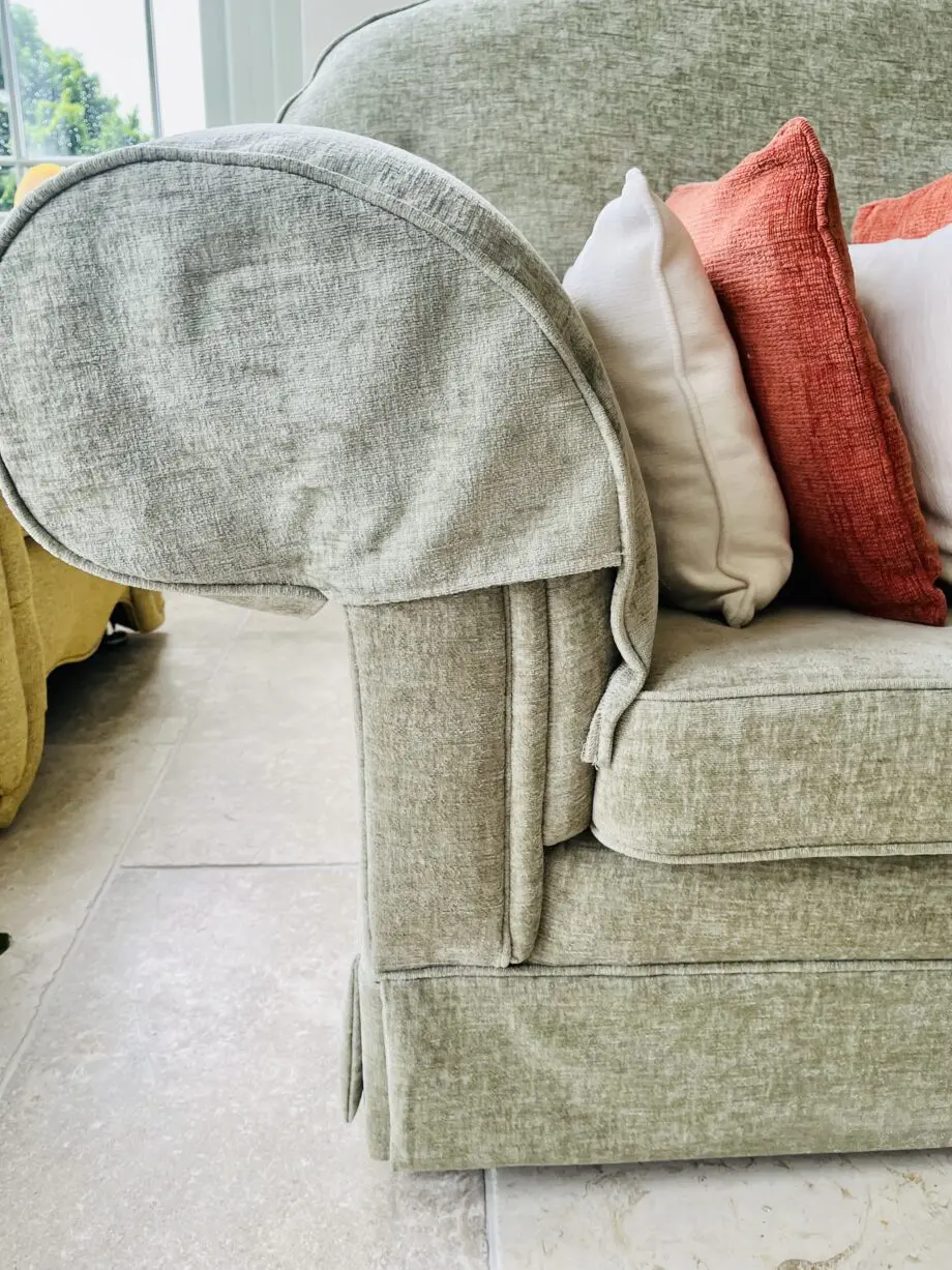 Newly upholstered pale sage 2 seater sofa