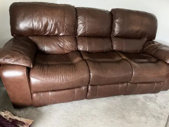 Harvey’s antique brown leather sofa