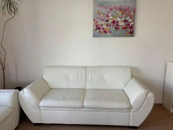 White genuine two seater sofa and two chairs