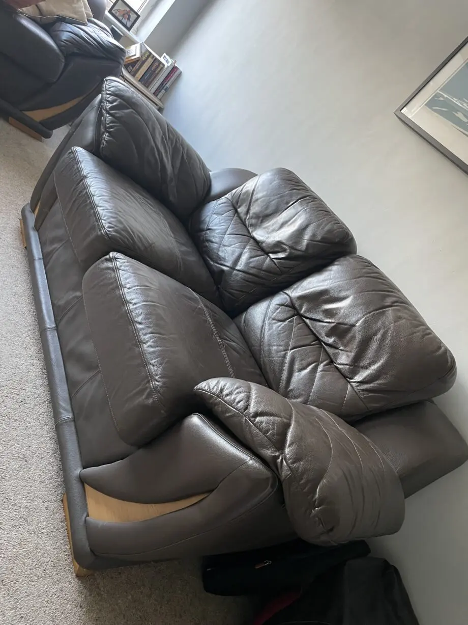 Two 2-seater brown leather sofas from DFS