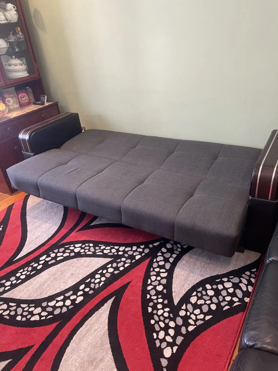 A charcoal 3 seated sofa