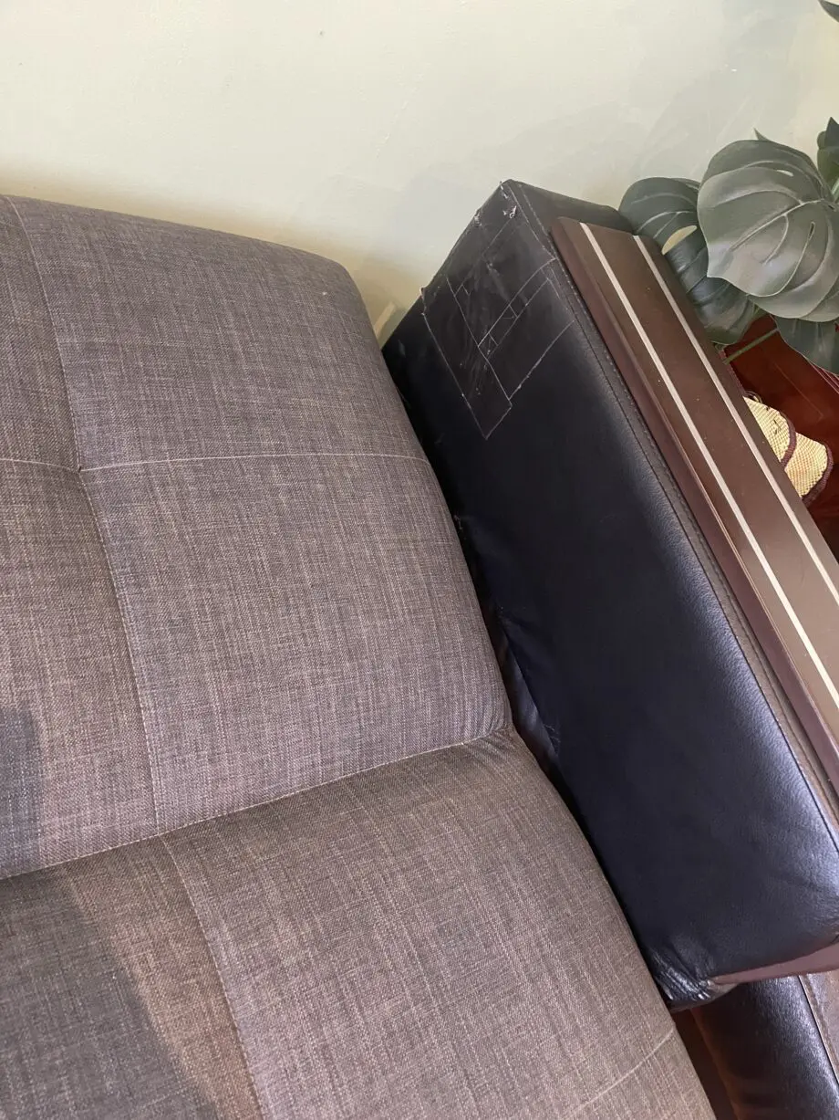 A charcoal 3 seated sofa