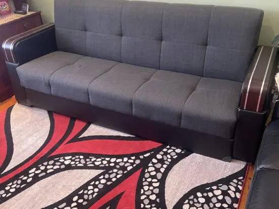 A charcoal 3 seated sofa