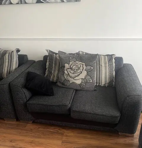 Beautiful charcoal grey two seater sofa