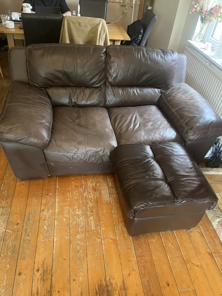 Brown leather sofas and poufees