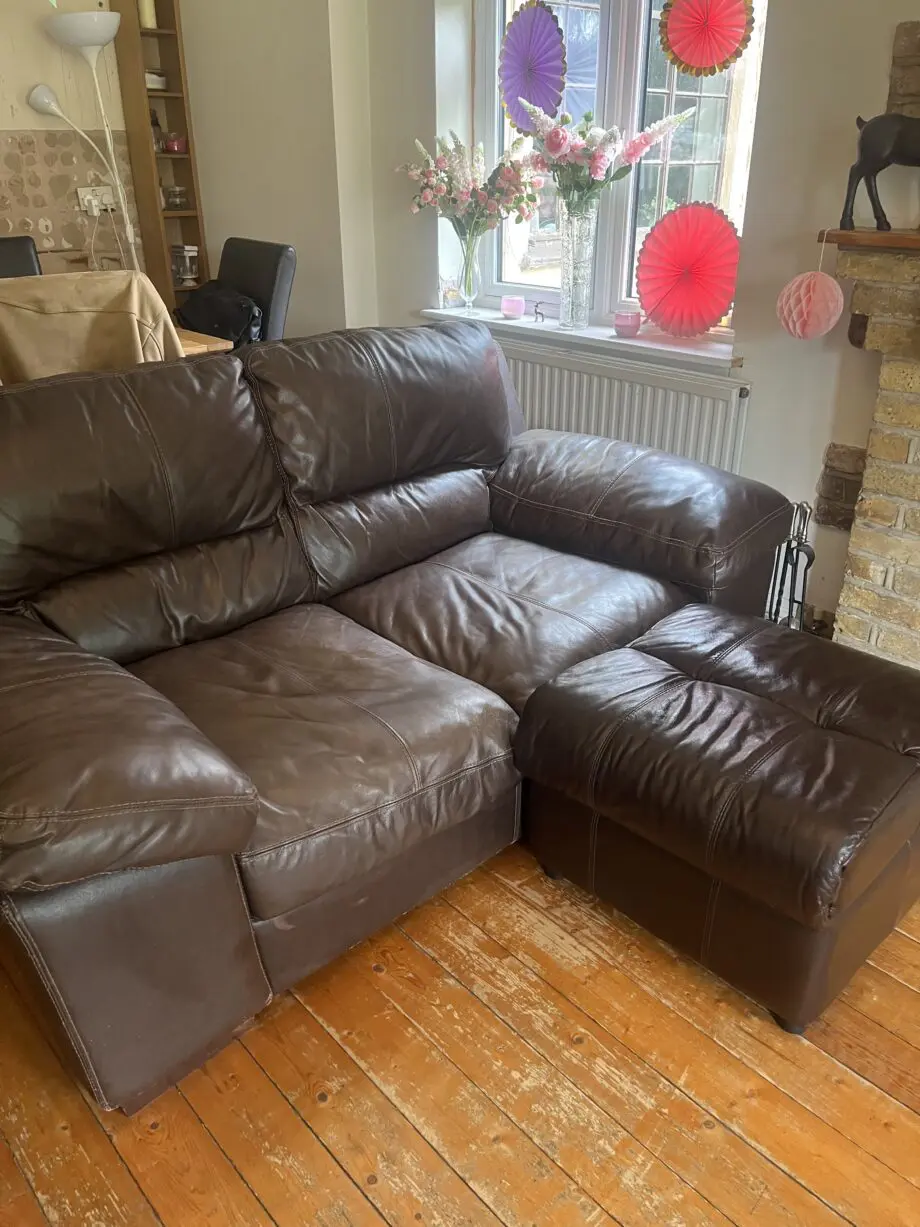 Brown leather sofas and poufees