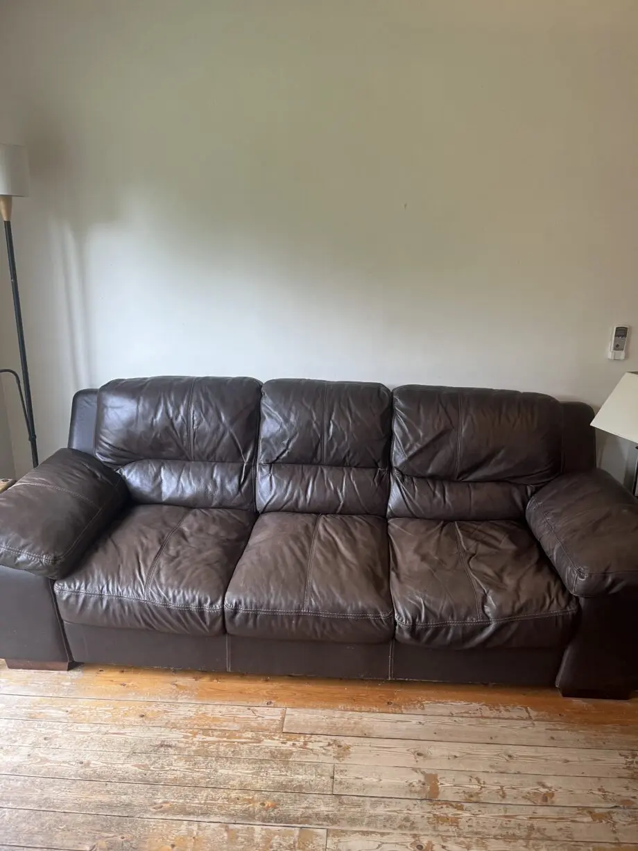 Brown leather sofas and poufees