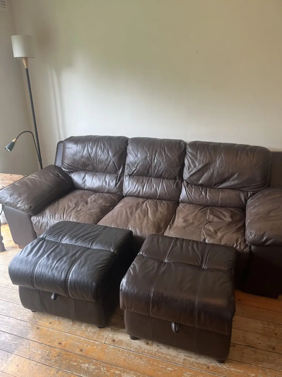 Brown leather sofas and poufees